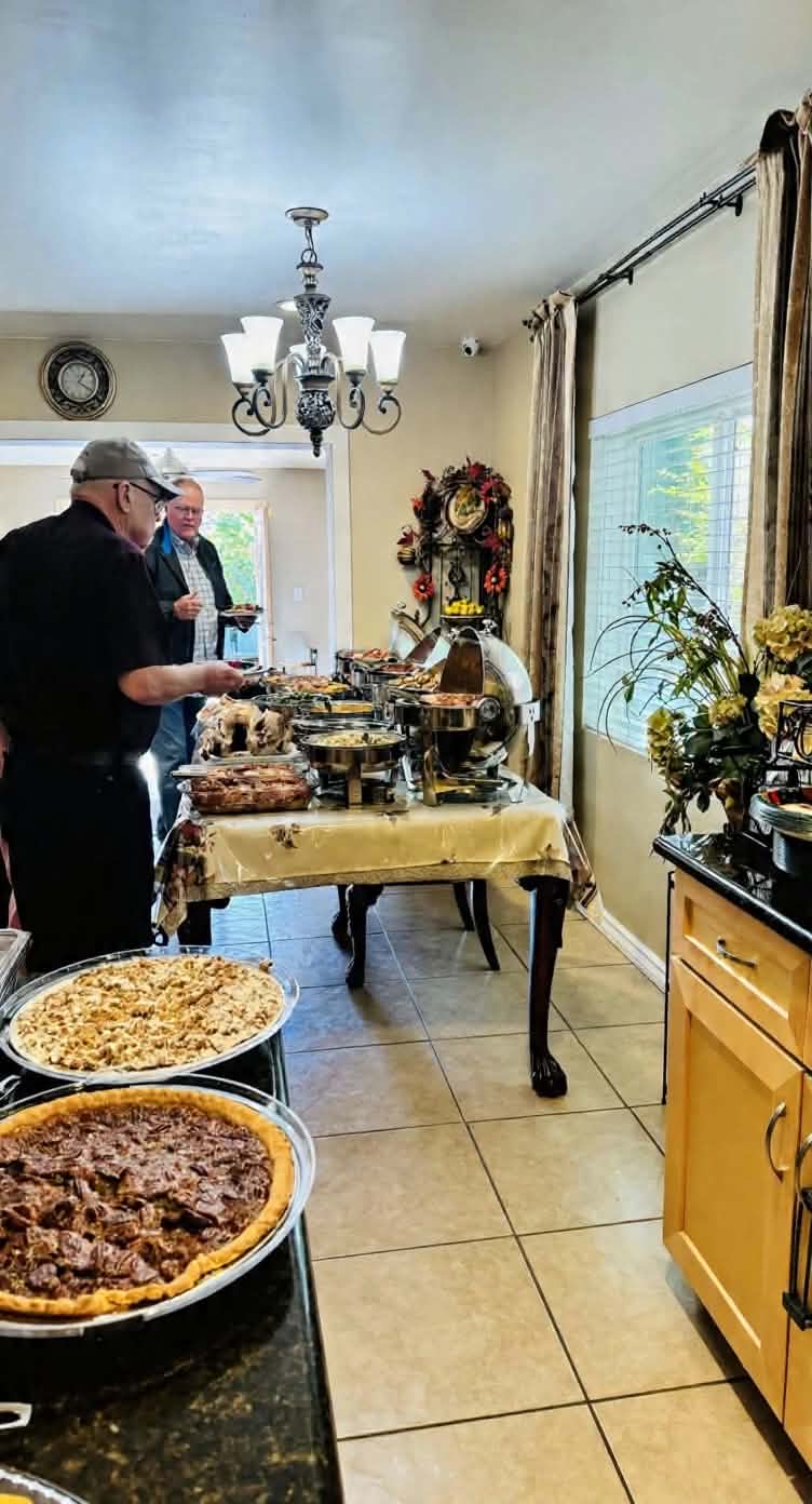 Guests serving themselves from a meal laid out in Rivendell's dining room