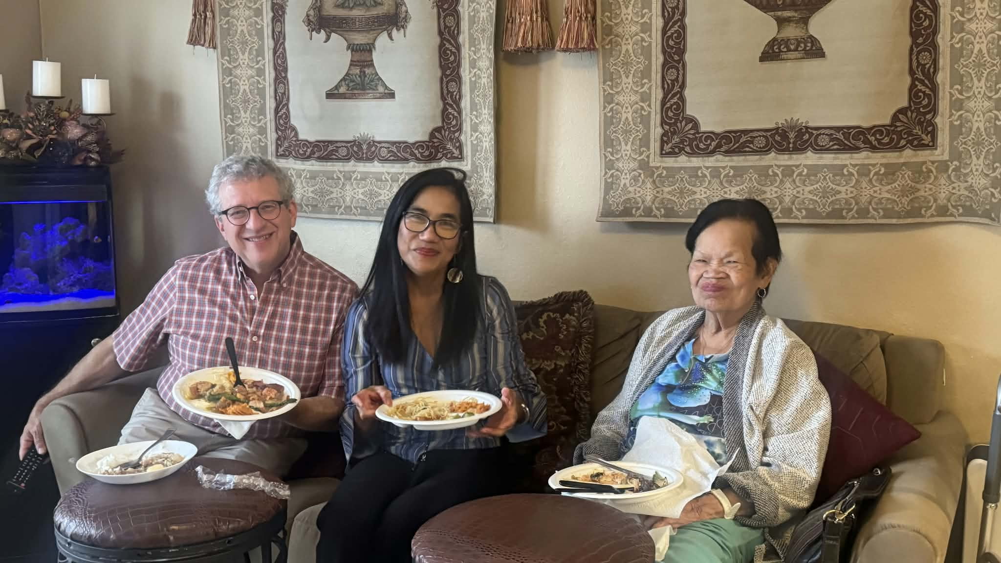 Three guests seated together in the lounge with lunch plates